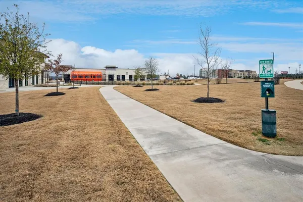 a swimming pool with an outdoor space and seating area