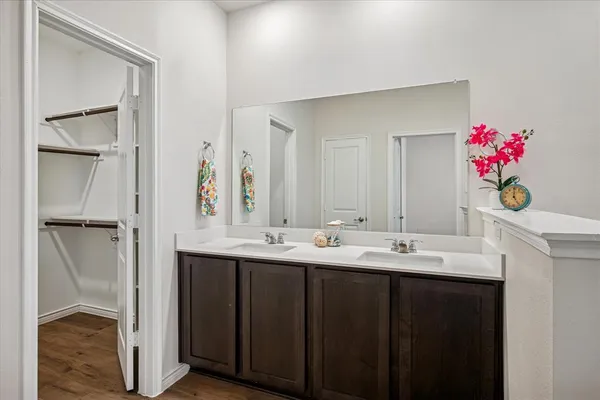 a bathroom with a sink vanity tub and shower