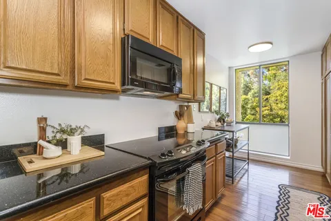 a kitchen with a stove and a microwave