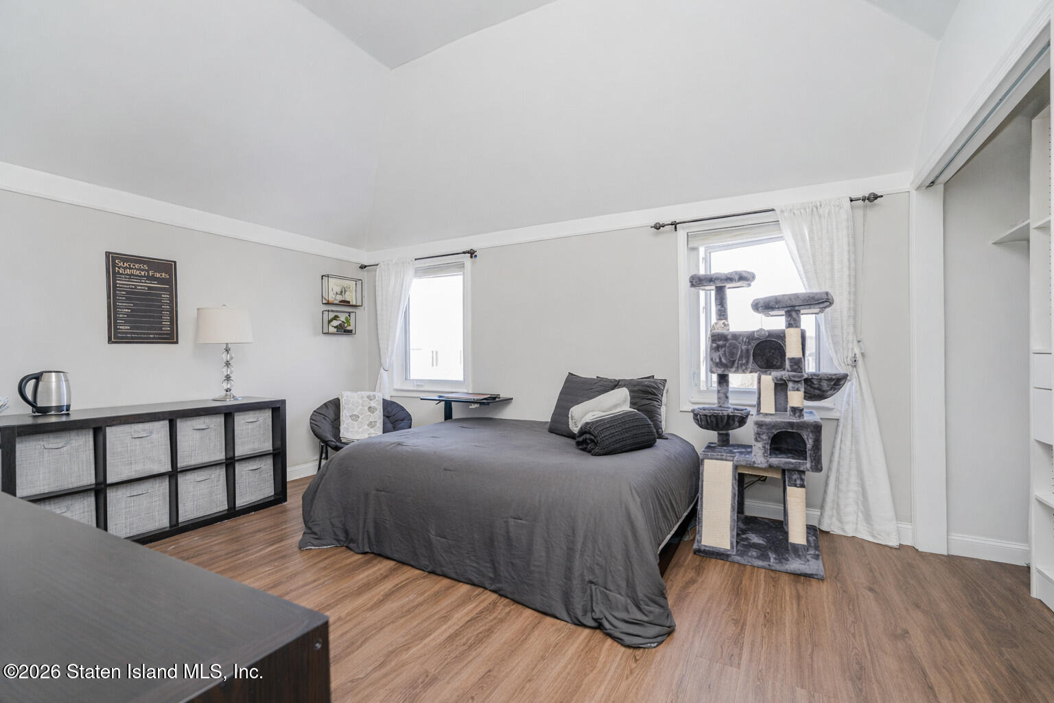 631 Travis Avenue Staten Island, NY 10314 - Photo 47 of 75 a bedroom with a bed and a night stand