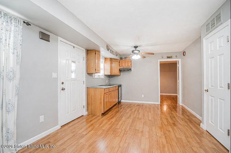 631 Travis Avenue Staten Island, NY 10314 - Photo 61 of 75 a view of a kitchen with wooden floor and a kitchen
