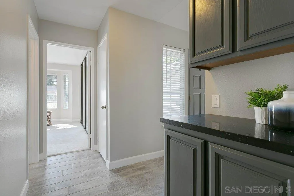 2725 Glasgow Drive Carlsbad, CA 92010 - Photo 16 of 29 a kitchen with a sink and a mirror