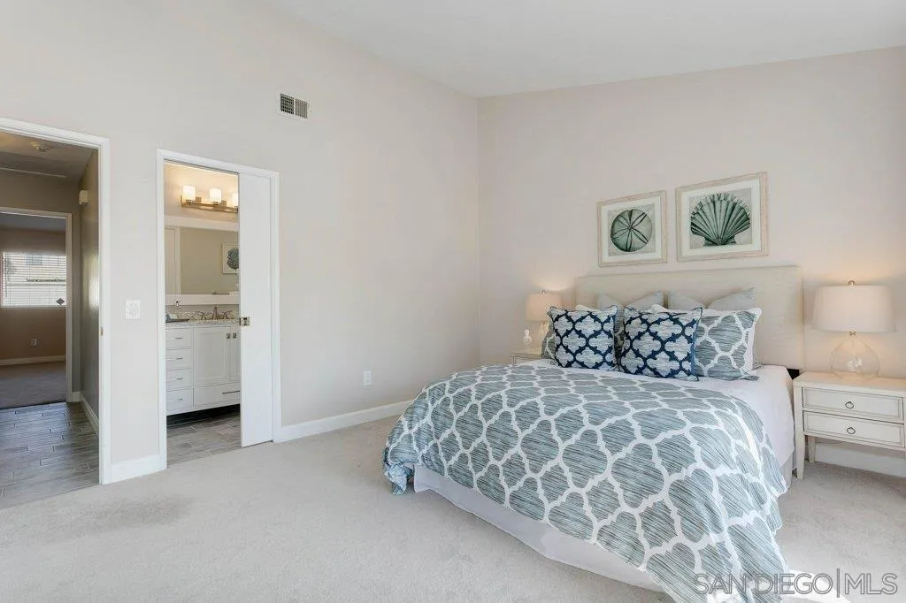 2725 Glasgow Drive Carlsbad, CA 92010 - Photo 18 of 29 a bedroom with a bed and painting on the wall