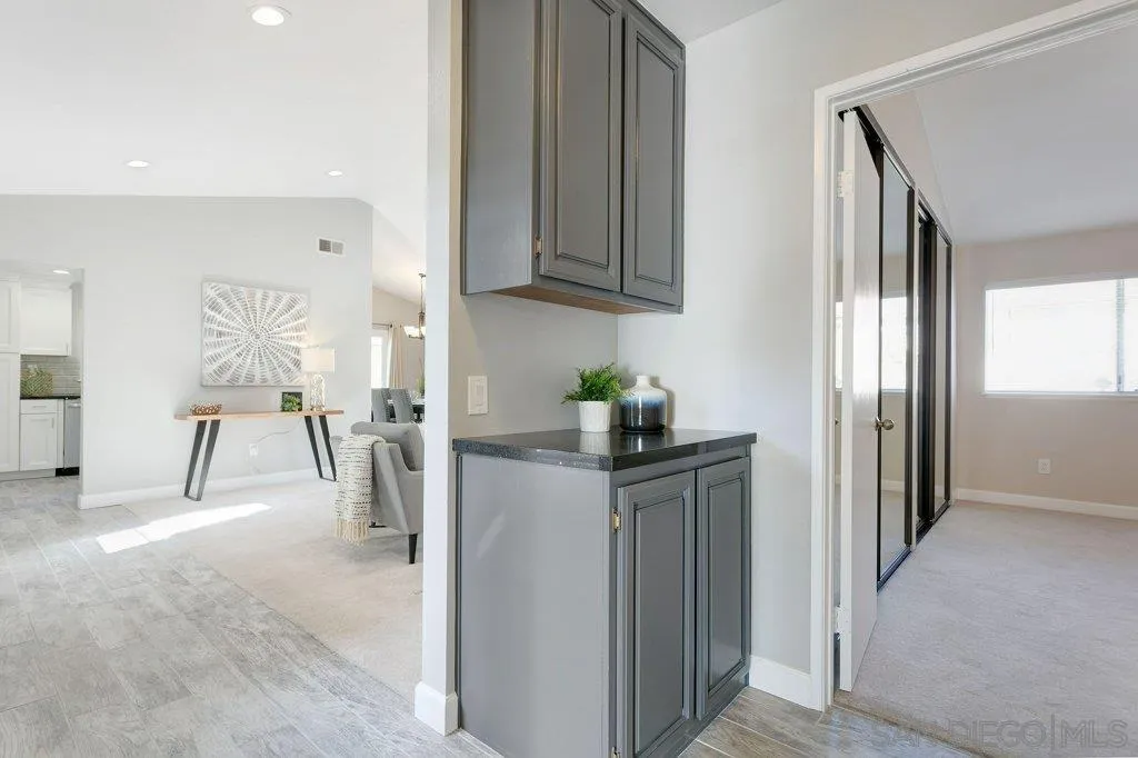 2725 Glasgow Drive Carlsbad, CA 92010 - Photo 20 of 29 a view of a kitchen with furniture and an entryway