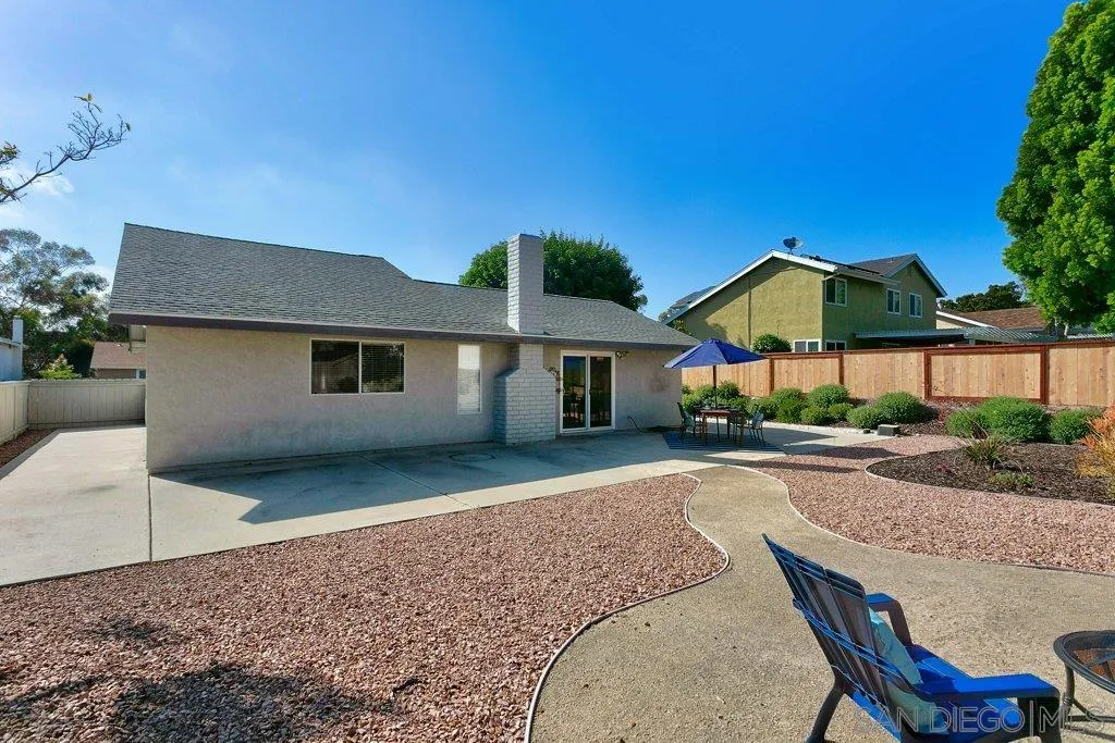 2725 Glasgow Drive Carlsbad, CA 92010 - Photo 26 of 29 a front view of house with yard and trees in the background