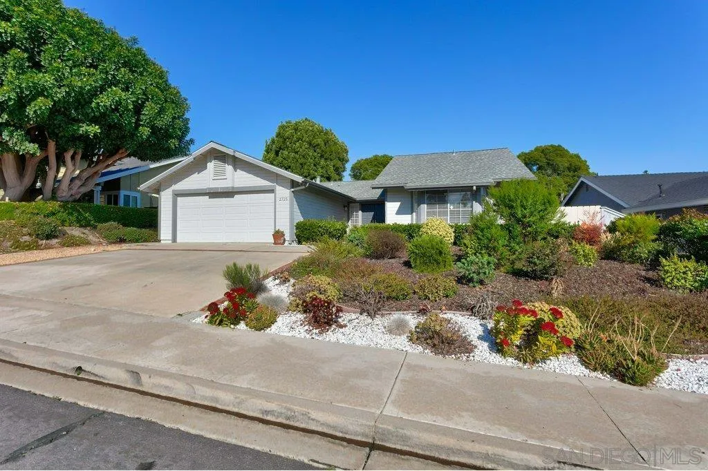 2725 Glasgow Drive Carlsbad, CA 92010 - Photo 28 of 29 a front view of a house with a garden