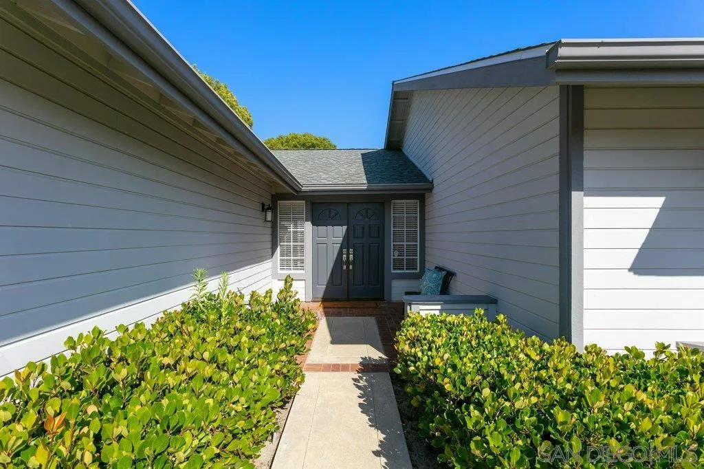 2725 Glasgow Drive Carlsbad, CA 92010 - Photo 3 of 29 a front view of a house with garden