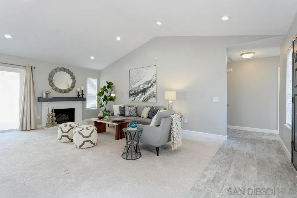 2725 Glasgow Drive Carlsbad, CA 92010 - Photo 4 of 29 a living room with furniture a fireplace and a fireplace