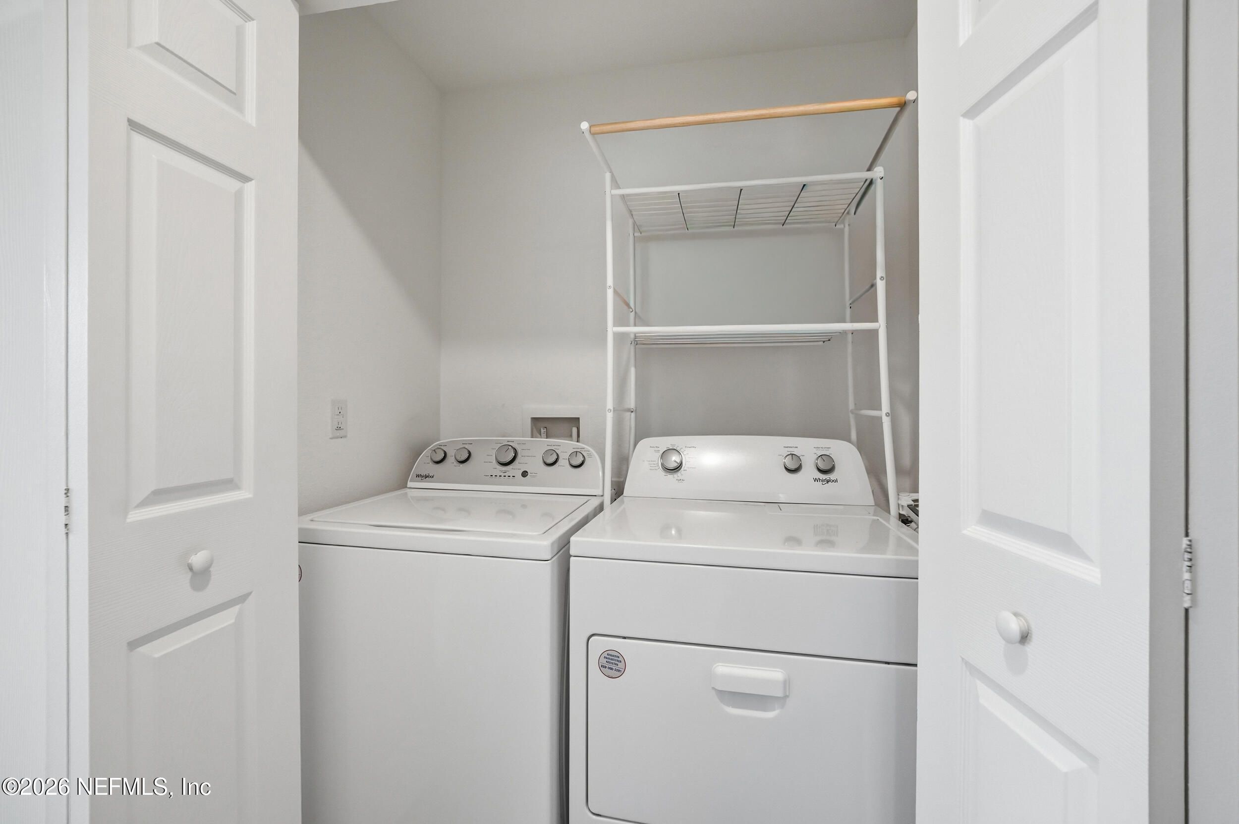 8323 Asteroid Street Jacksonville, FL 32256 - Photo 12 of 27 a utility room with dryer and washer