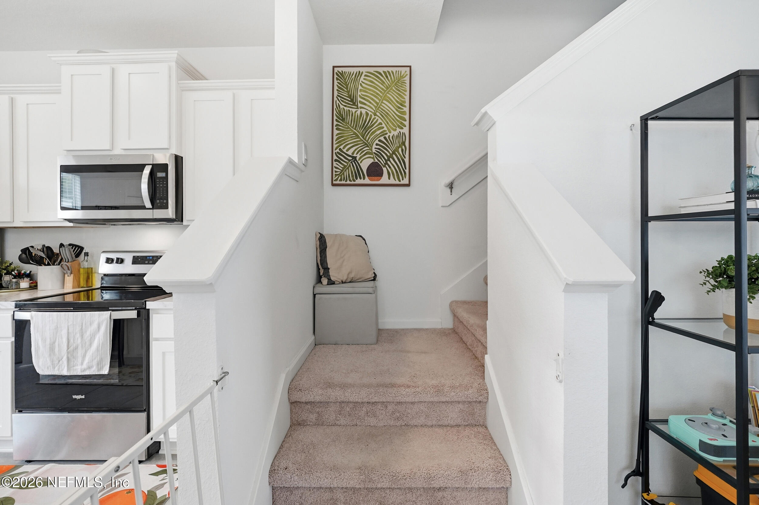 8323 Asteroid Street Jacksonville, FL 32256 - Photo 13 of 27 a view of a kitchen with furniture and staircase