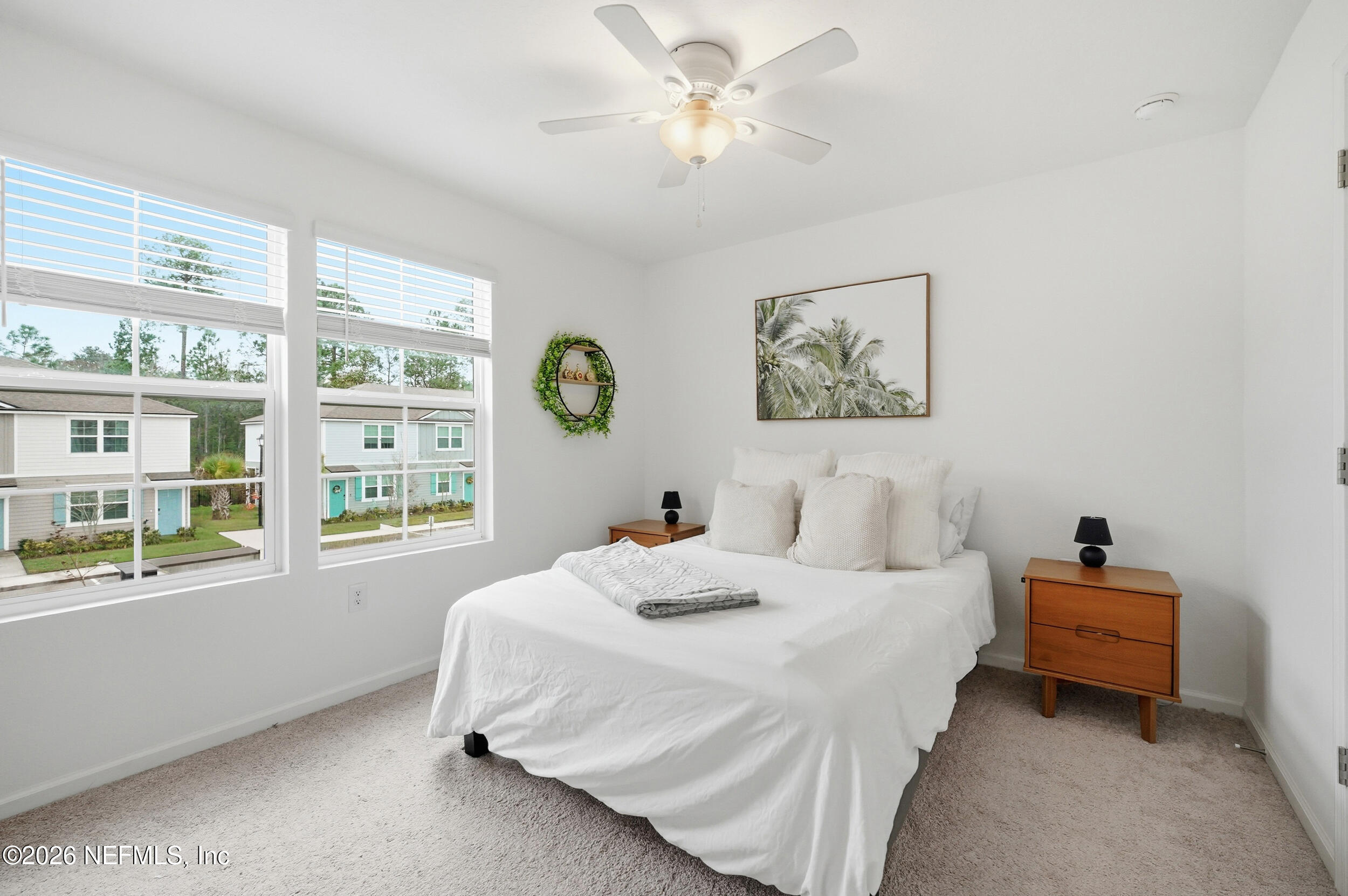 8323 Asteroid Street Jacksonville, FL 32256 - Photo 14 of 27 a bedroom with bed and a large window