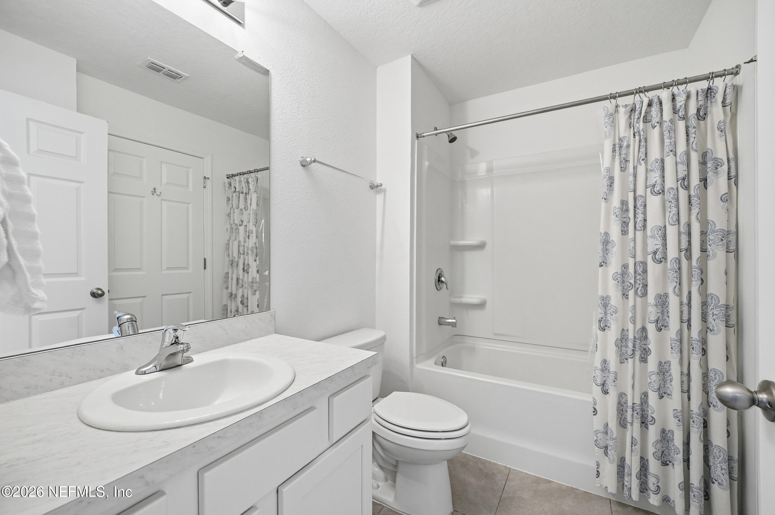 8323 Asteroid Street Jacksonville, FL 32256 - Photo 20 of 27 a bathroom with a sink toilet and shower