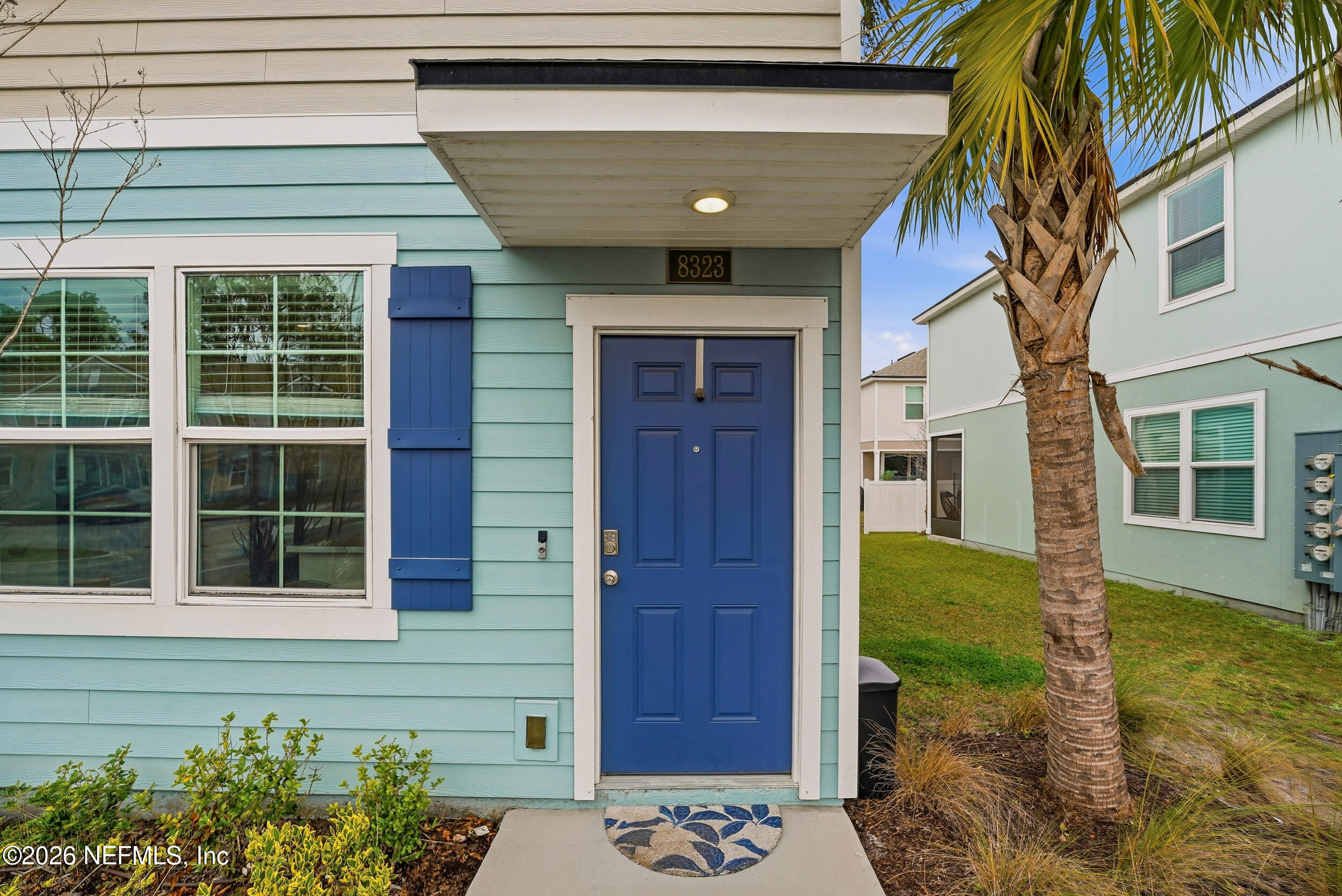 8323 Asteroid Street Jacksonville, FL 32256 - Photo 2 of 27 a front view of a house with a yard