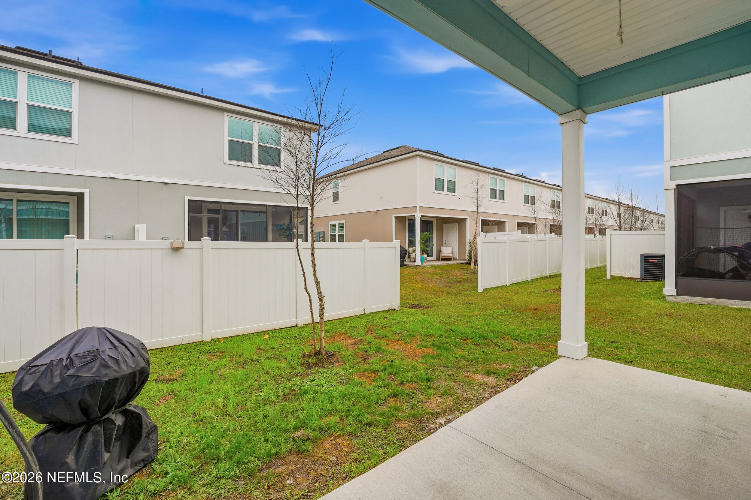 8323 Asteroid Street Jacksonville, FL 32256 - Photo 22 of 27 a view of a house with backyard and garden