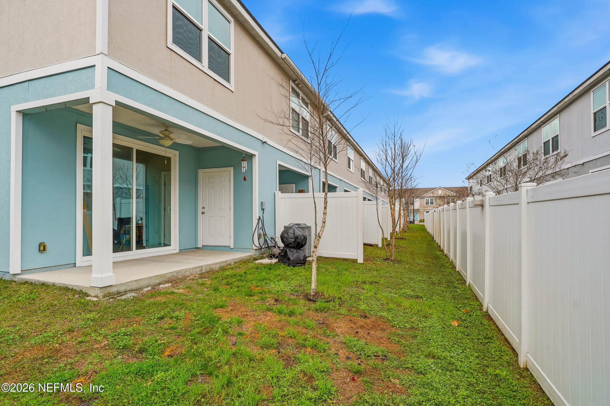 8323 Asteroid Street Jacksonville, FL 32256 - Photo 23 of 27 a backyard of a house with barbeque oven and plants