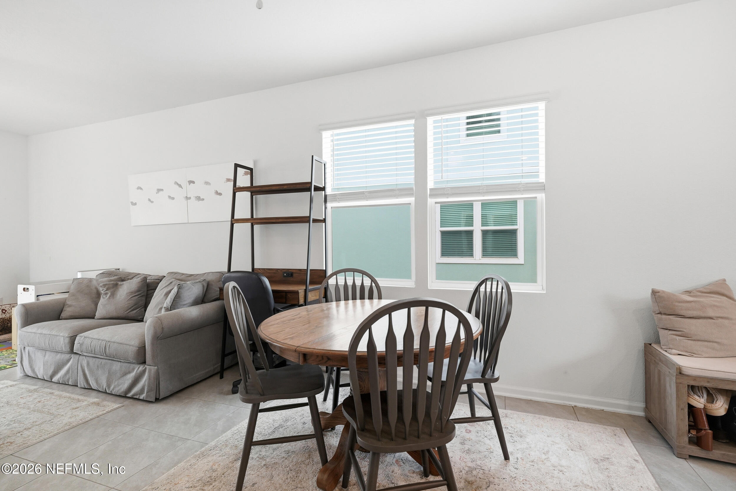 8323 Asteroid Street Jacksonville, FL 32256 - Photo 6 of 27 a living room with furniture and a window