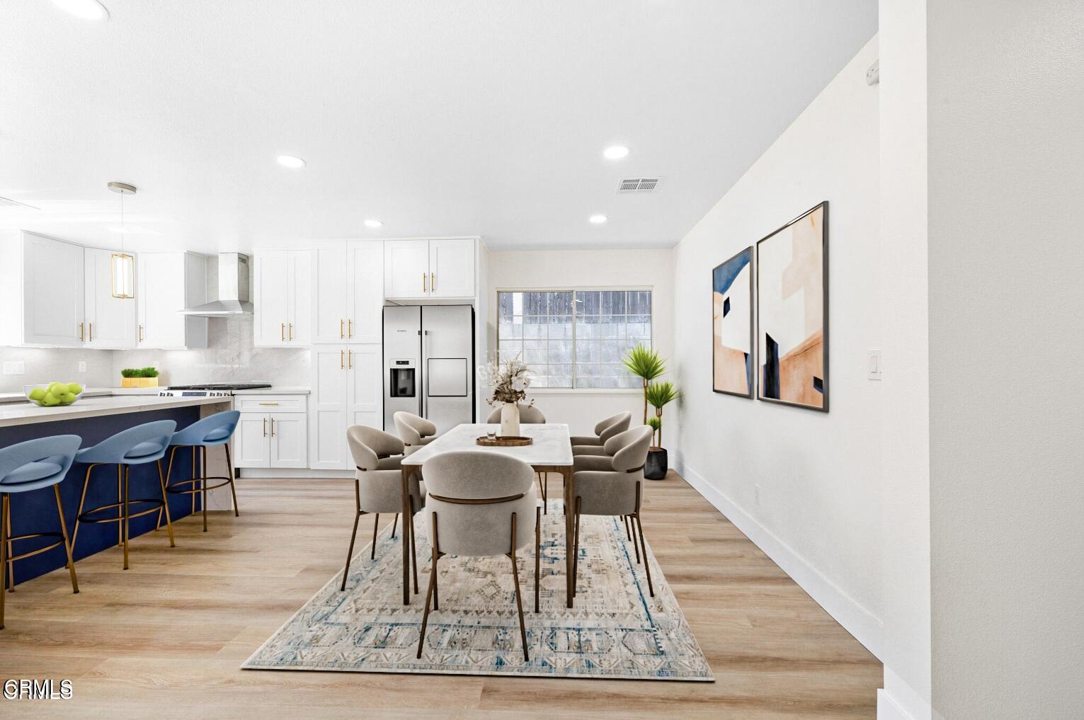6015 Peppertree Lane Simi Valley, CA 93063 - Photo 5 of 15 a living room with stainless steel appliances kitchen island granite countertop furniture and a rug