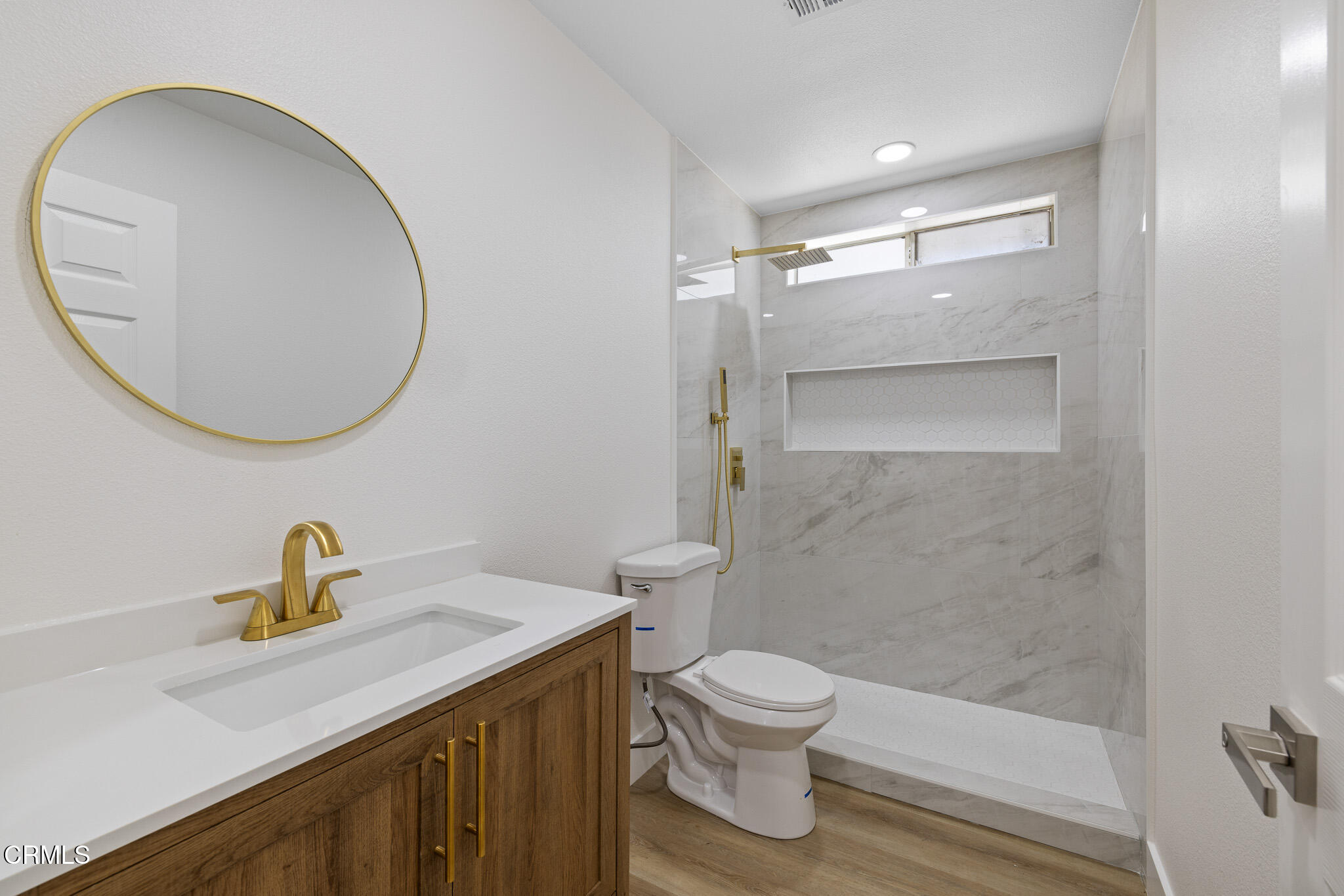 6015 Peppertree Lane Simi Valley, CA 93063 - Photo 8 of 15 a bathroom with a sink a toilet and a mirror