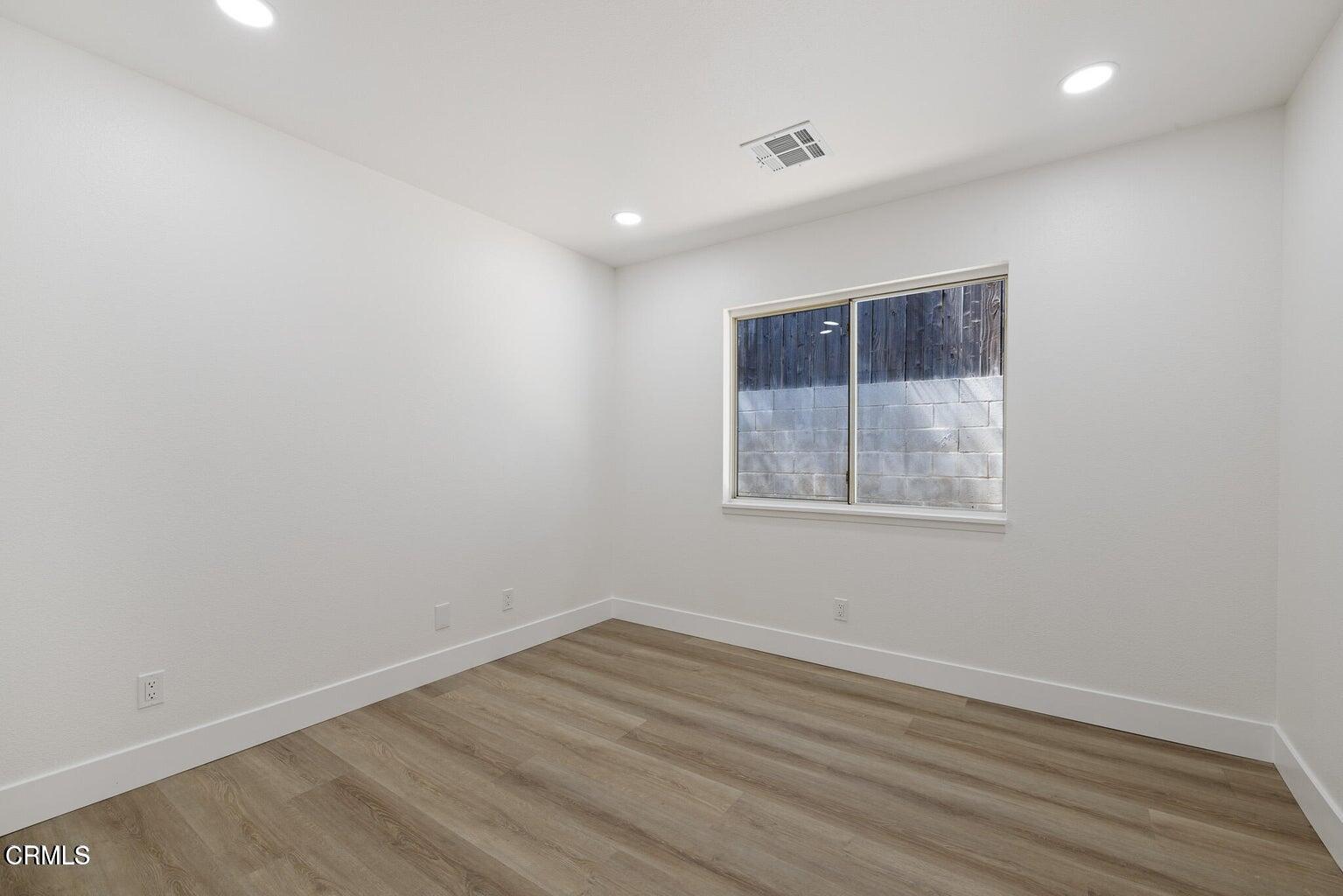6015 Peppertree Lane Simi Valley, CA 93063 - Photo 9 of 15 wooden floor in an empty room with a window
