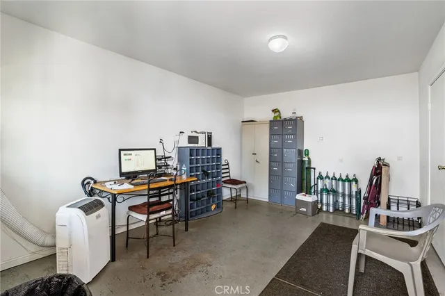a view of a workspace with furniture and toys