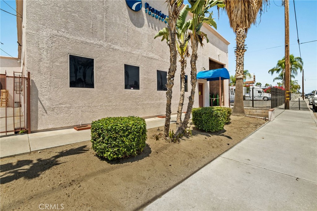 484 East Redlands Boulevard San Bernardino, CA 92408 - Photo 26 of 27 a front view of a house with garden
