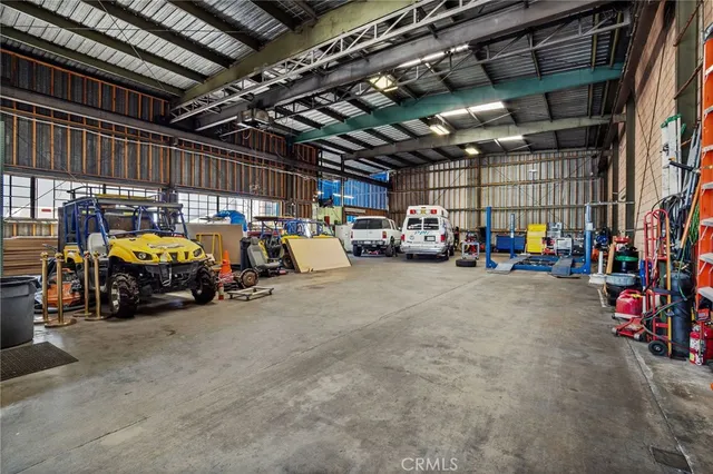 a view of parking garage with cars