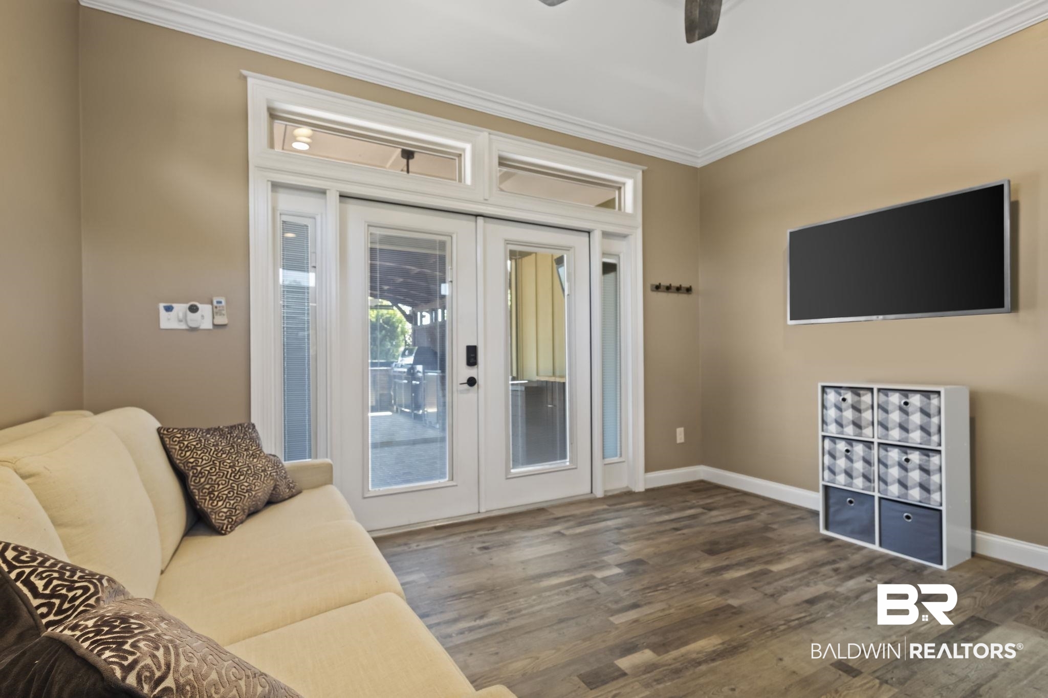 212 Magnifico Drive Foley, AL 36535 - Photo 23 of 50 Living room featuring french doors, ornamental molding, dark hardwood / wood-style flooring, and ceiling fan