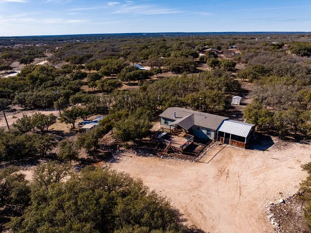 an aerial view of residential house with parking space