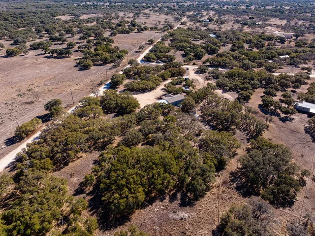 a view of mountains in between the road