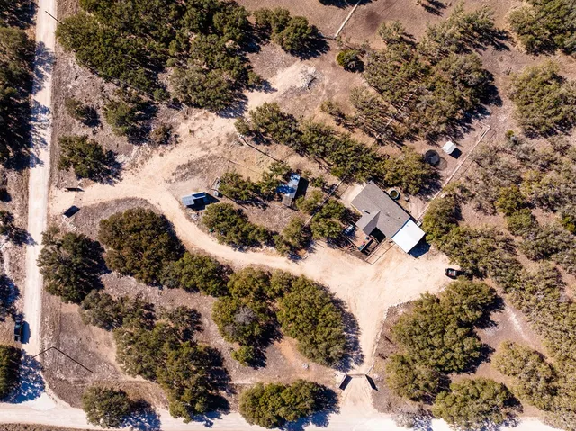 an aerial view of residential houses with outdoor space