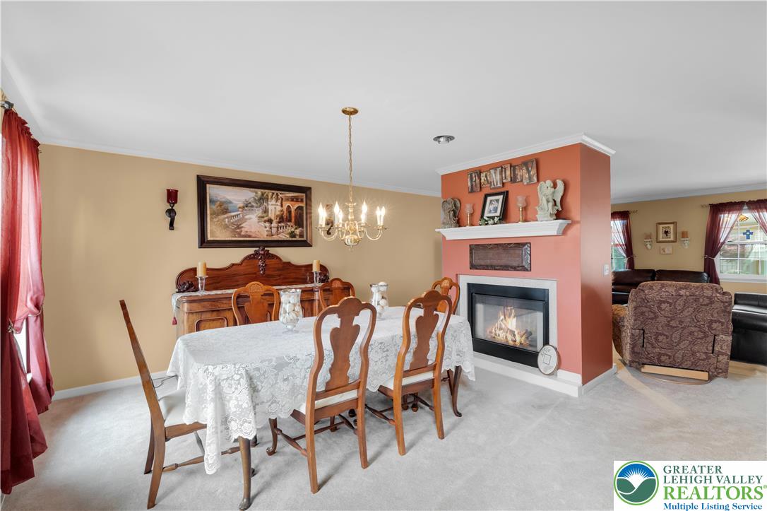 3830 McIntosh Drive Orefield, PA 18069 - Photo 6 of 36 a view of a livingroom with furniture and a fireplace