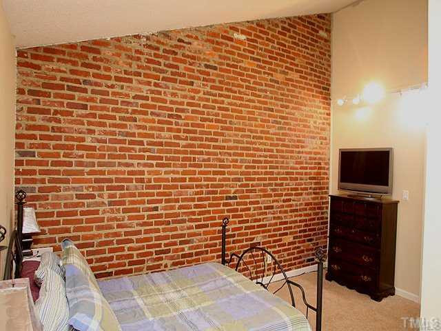 5418 Wayne Street Raleigh, NC 27606 - Photo 7 of 11 ALT View Master Bedroom, Exposed Brick Wall, NEW Carpet, High Ceiling, Fresh Paint. Master Bedroom