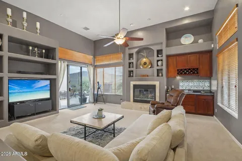 a view of a livingroom with furniture and a window