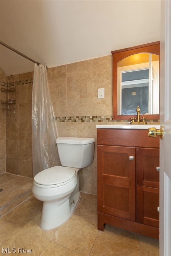 3786 Berkeley Road Cleveland Heights, OH 44118 - Photo 22 of 29 Bathroom featuring toilet, vanity with extensive cabinet space, and tile flooring