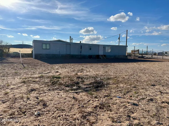 a kitchen with sink and cabinets