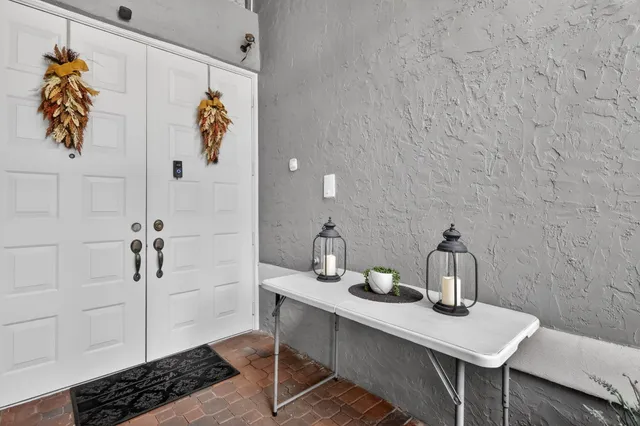 a view of a workspace with furniture and bathroom