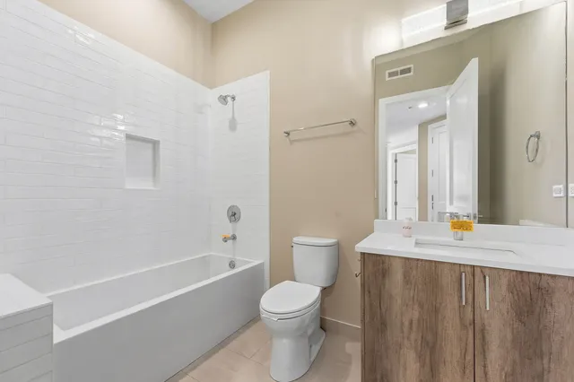 a bathroom with a toilet a sink and a bathtub