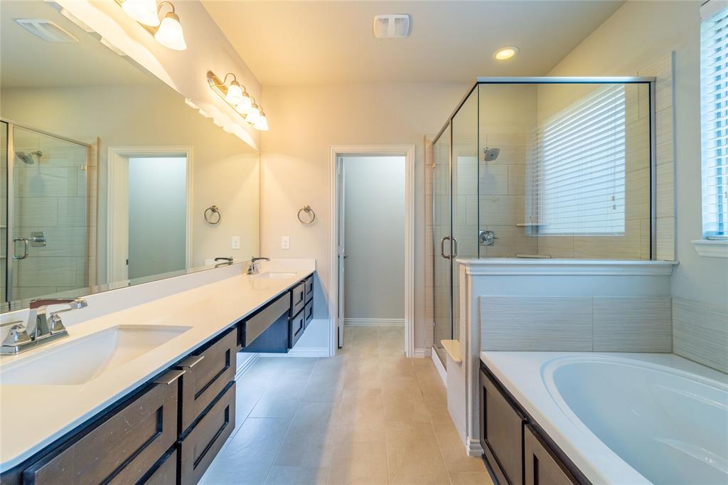 4666 Rhett Lane, Unit E Carrollton, TX 75010 - Photo 23 of 40 Under counter lighting adds to the atmosphere of this relaxing space - you'll feel like you're in a spa