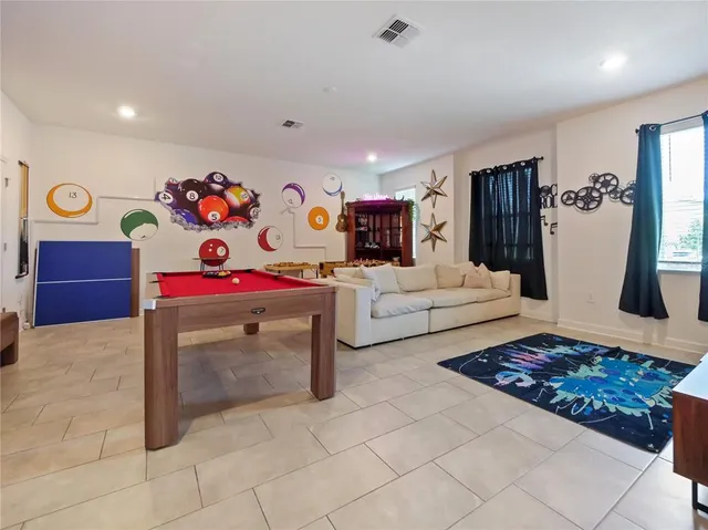 a view of a hallway with dining area