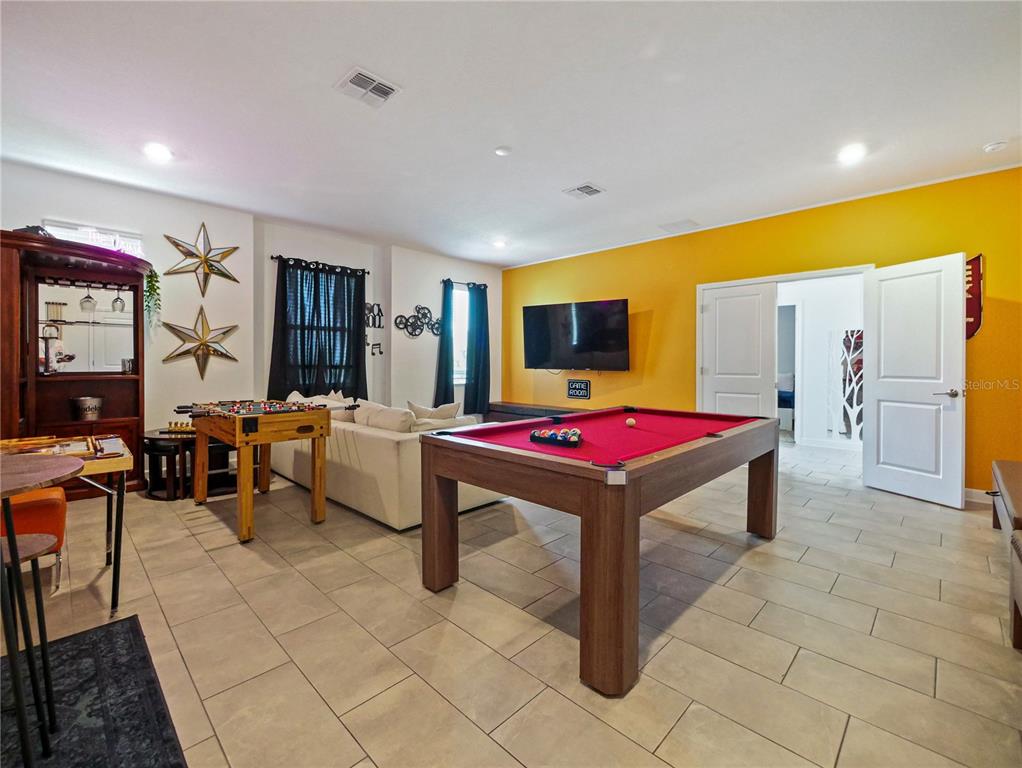 9084 Sommerset Hills Drive Davenport, FL 33896 - Photo 13 of 63 a room with furniture pool table and windows