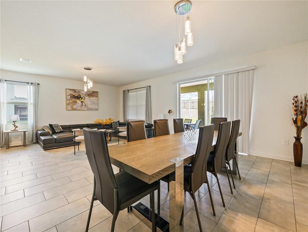 9084 Sommerset Hills Drive Davenport, FL 33896 - Photo 19 of 63 a view of a a dining room and livingroom view