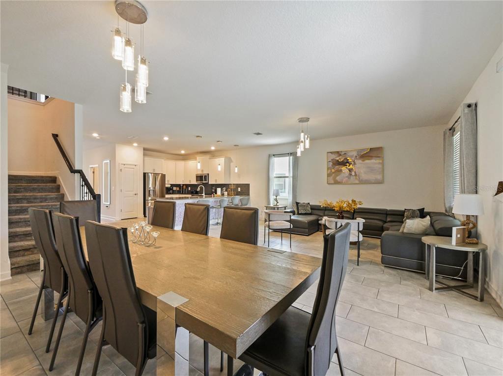 9084 Sommerset Hills Drive Davenport, FL 33896 - Photo 21 of 63 a view of a dining area with furniture