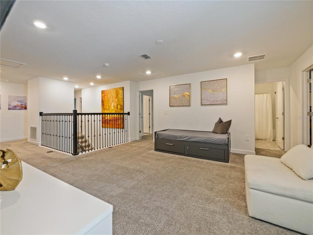 9084 Sommerset Hills Drive Davenport, FL 33896 - Photo 27 of 63 a view of a livingroom with furniture and a rug