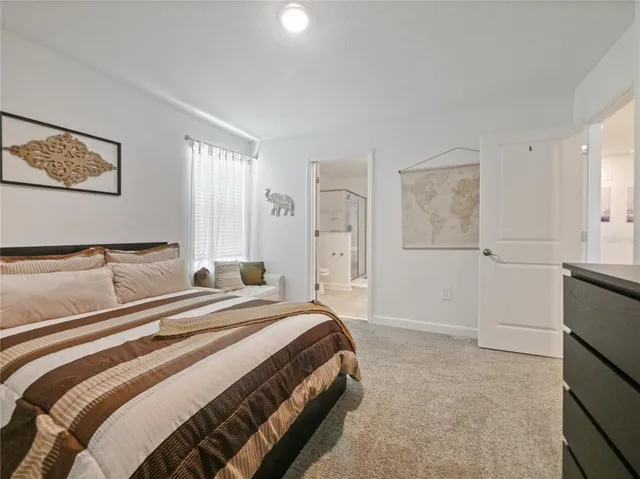 a bedroom with two beds and a couch