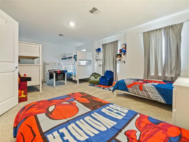 a bedroom with a bed and a table