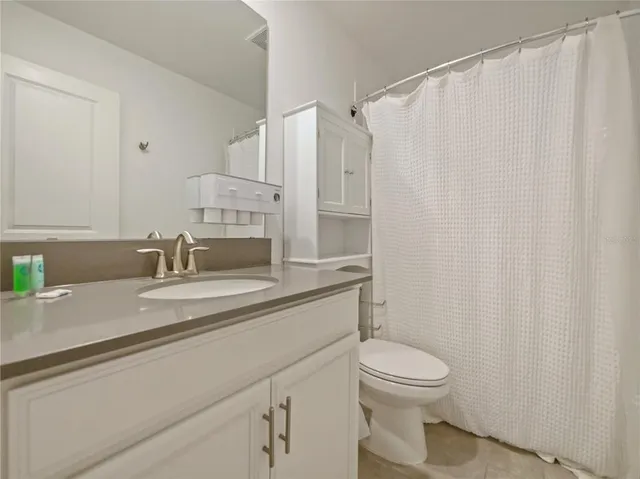 a bedroom with a bed and closet