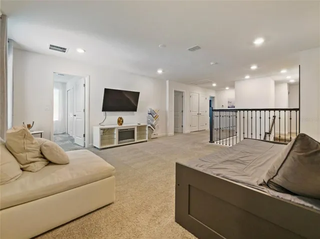 a view of a bathroom with sink mirror and shower