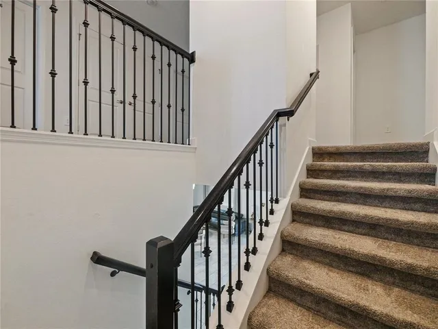 a view of a swimming pool with a lounge chair