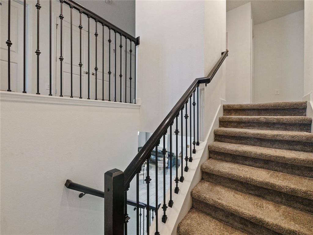 9084 Sommerset Hills Drive Davenport, FL 33896 - Photo 46 of 63 a view of staircase with railing and white walls