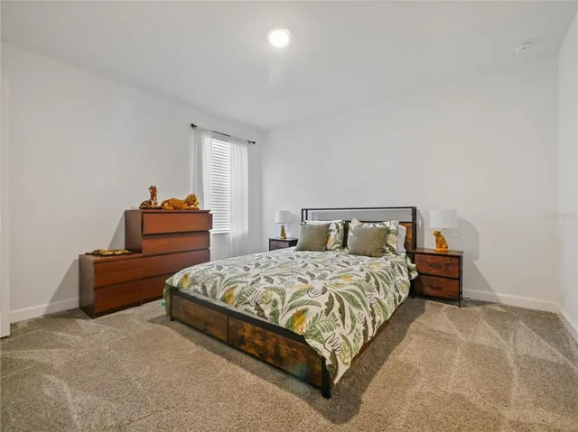 a open kitchen with stainless steel appliances kitchen island granite countertop a refrigerator a sink and a counter top space